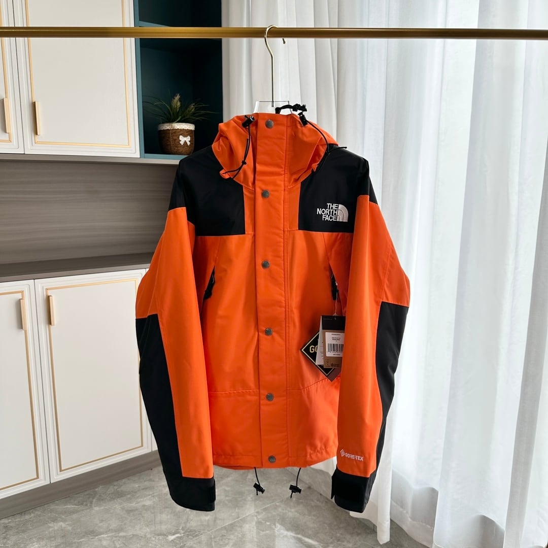 【THE NORTH FACE】マウンテンパーカー オレンジ レディース メンズ 防水 防風 ジャケット オレンジ ブラック ユニセックス 登山 アウトドア ストリート
