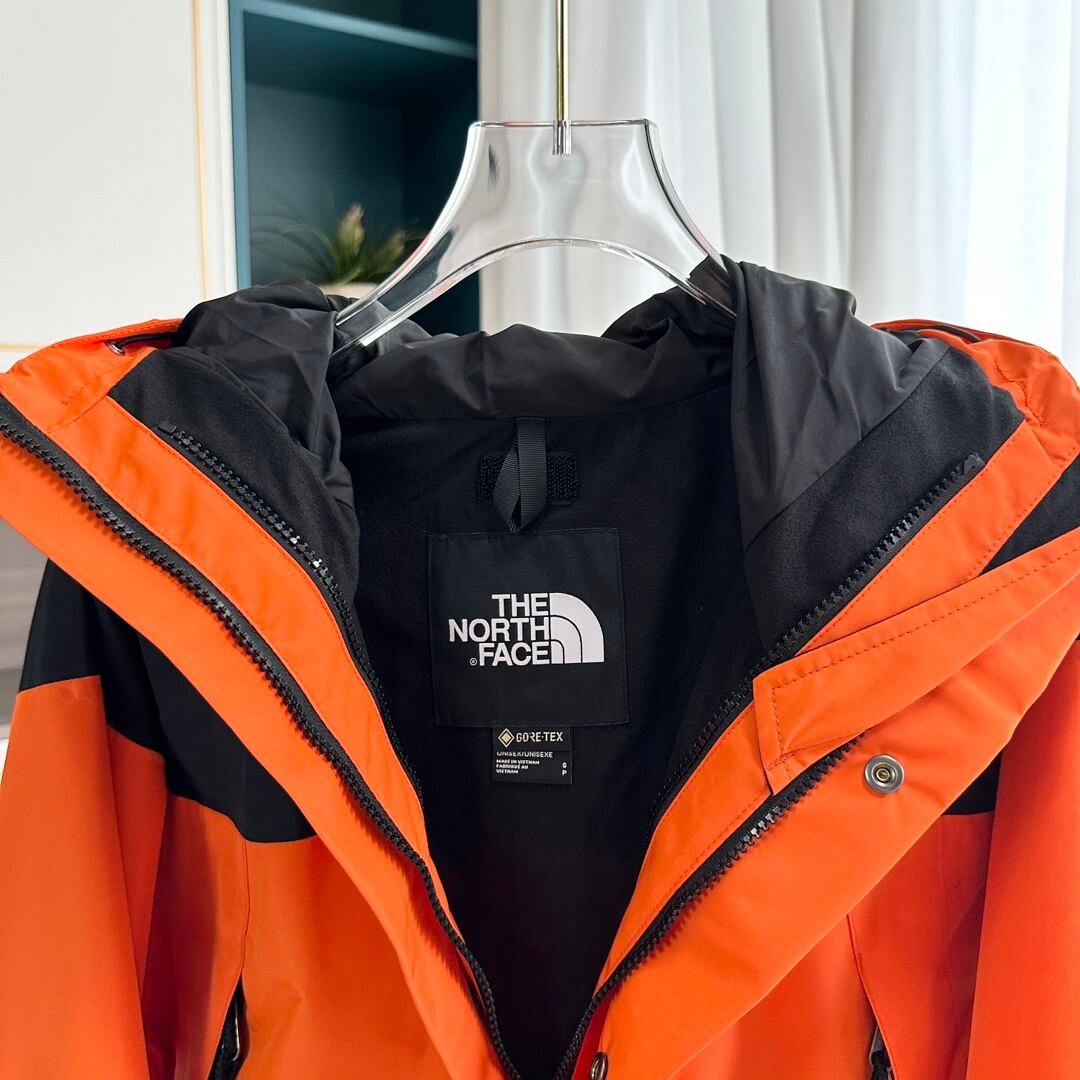 【THE NORTH FACE】マウンテンパーカー オレンジ レディース メンズ 防水 防風 ジャケット オレンジ ブラック ユニセックス 登山 アウトドア ストリート
