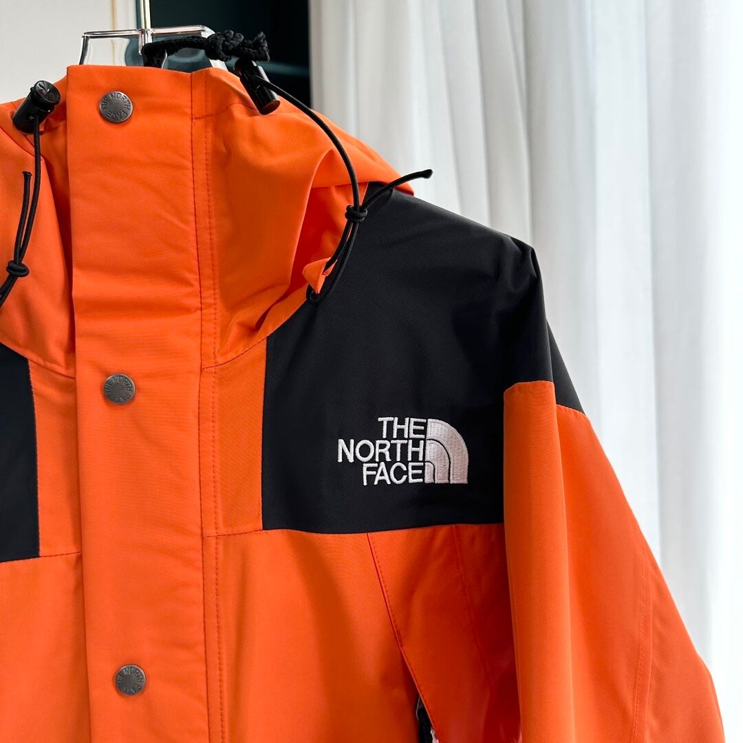 【THE NORTH FACE】マウンテンパーカー オレンジ レディース メンズ 防水 防風 ジャケット オレンジ ブラック ユニセックス 登山 アウトドア ストリート