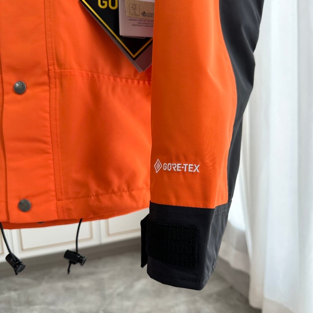 【THE NORTH FACE】マウンテンパーカー オレンジ レディース メンズ 防水 防風 ジャケット オレンジ ブラック ユニセックス 登山 アウトドア ストリート