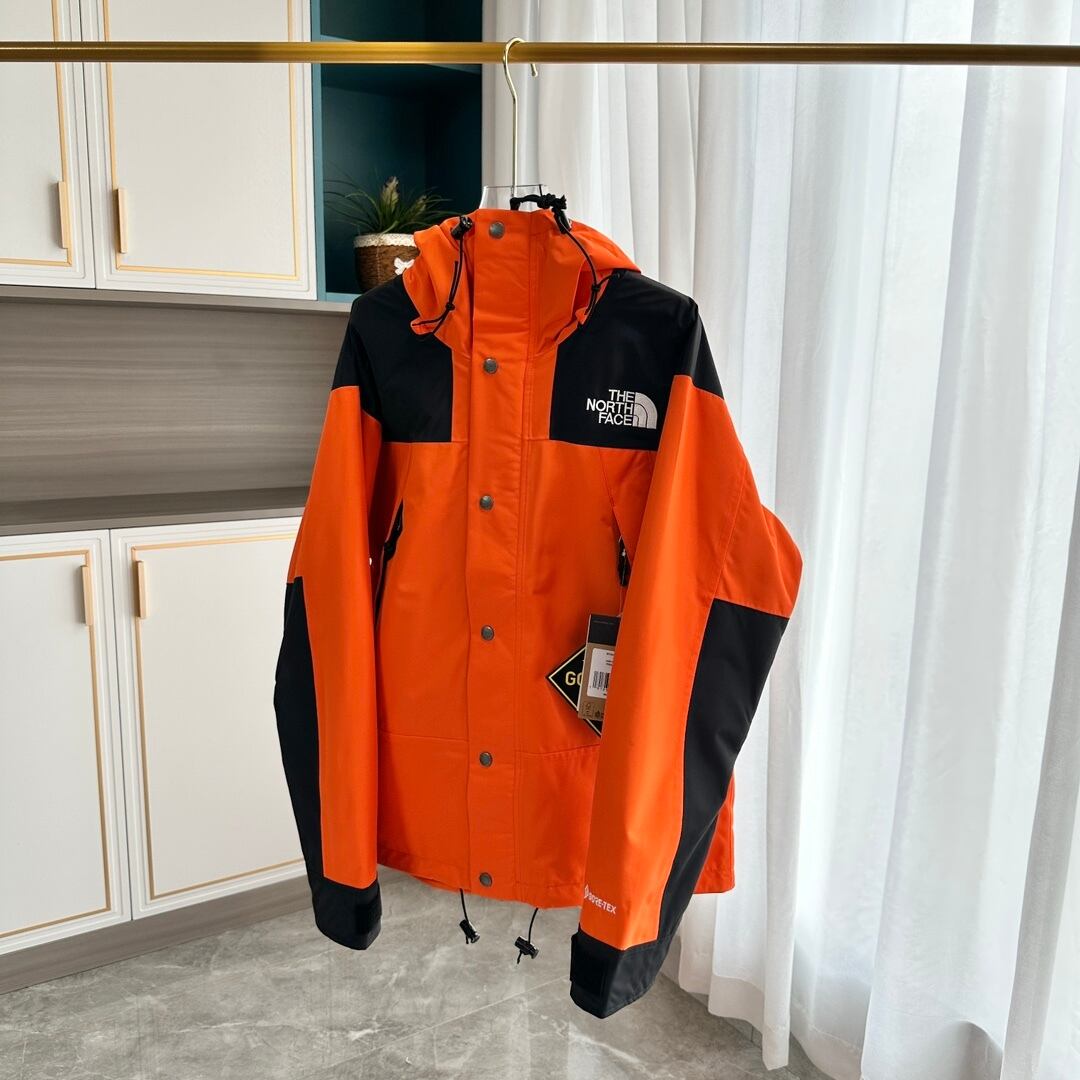 【THE NORTH FACE】マウンテンパーカー オレンジ レディース メンズ 防水 防風 ジャケット オレンジ ブラック ユニセックス 登山 アウトドア ストリート