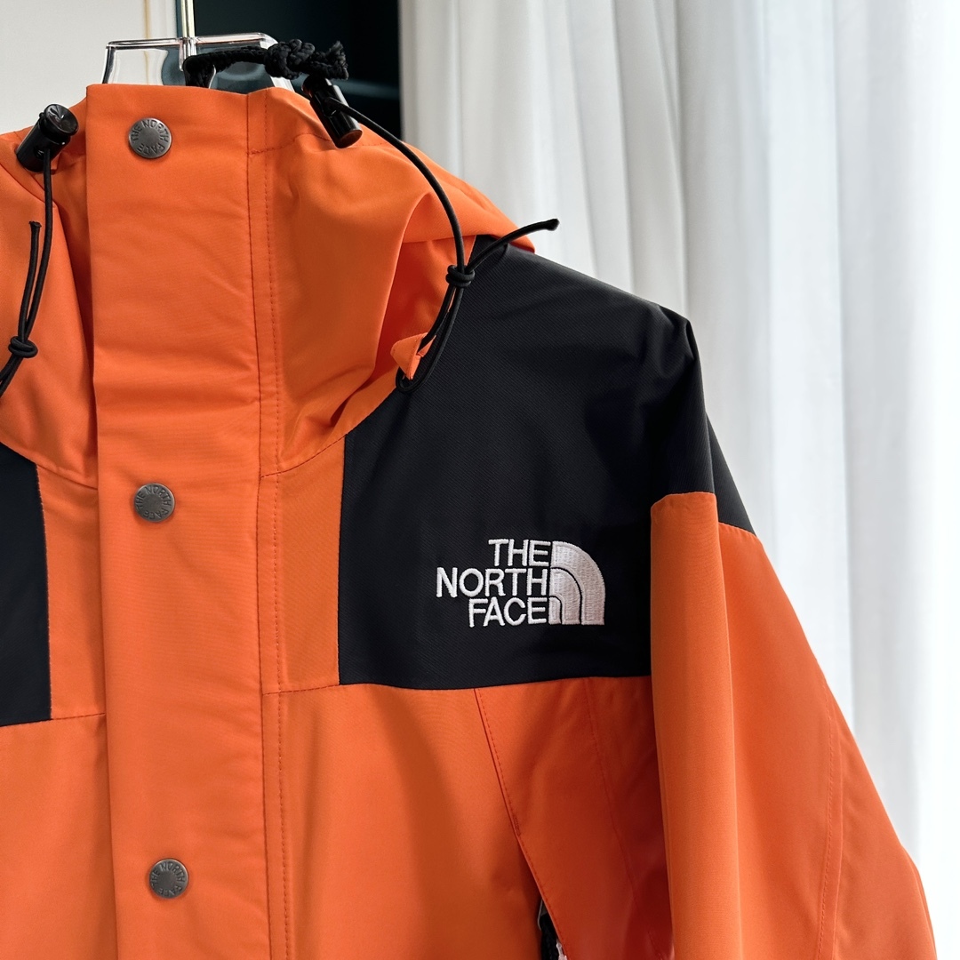 【THE NORTH FACE】マウンテンパーカー オレンジ レディース メンズ 防水 防風 ジャケット オレンジ ブラック ユニセックス 登山 アウトドア ストリート